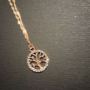 Gold tone tree of life necklace